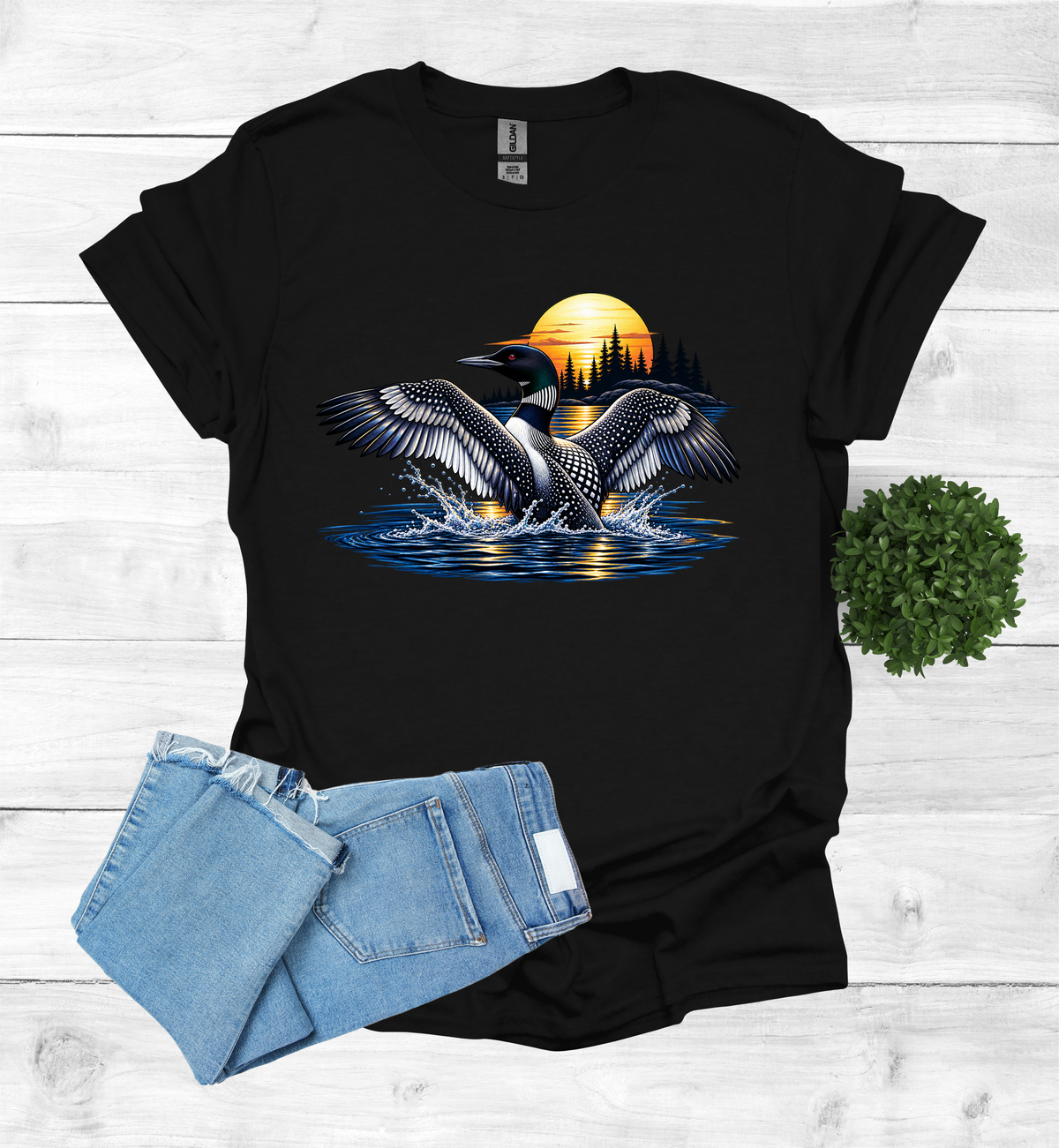 Loon flutters wings on the water