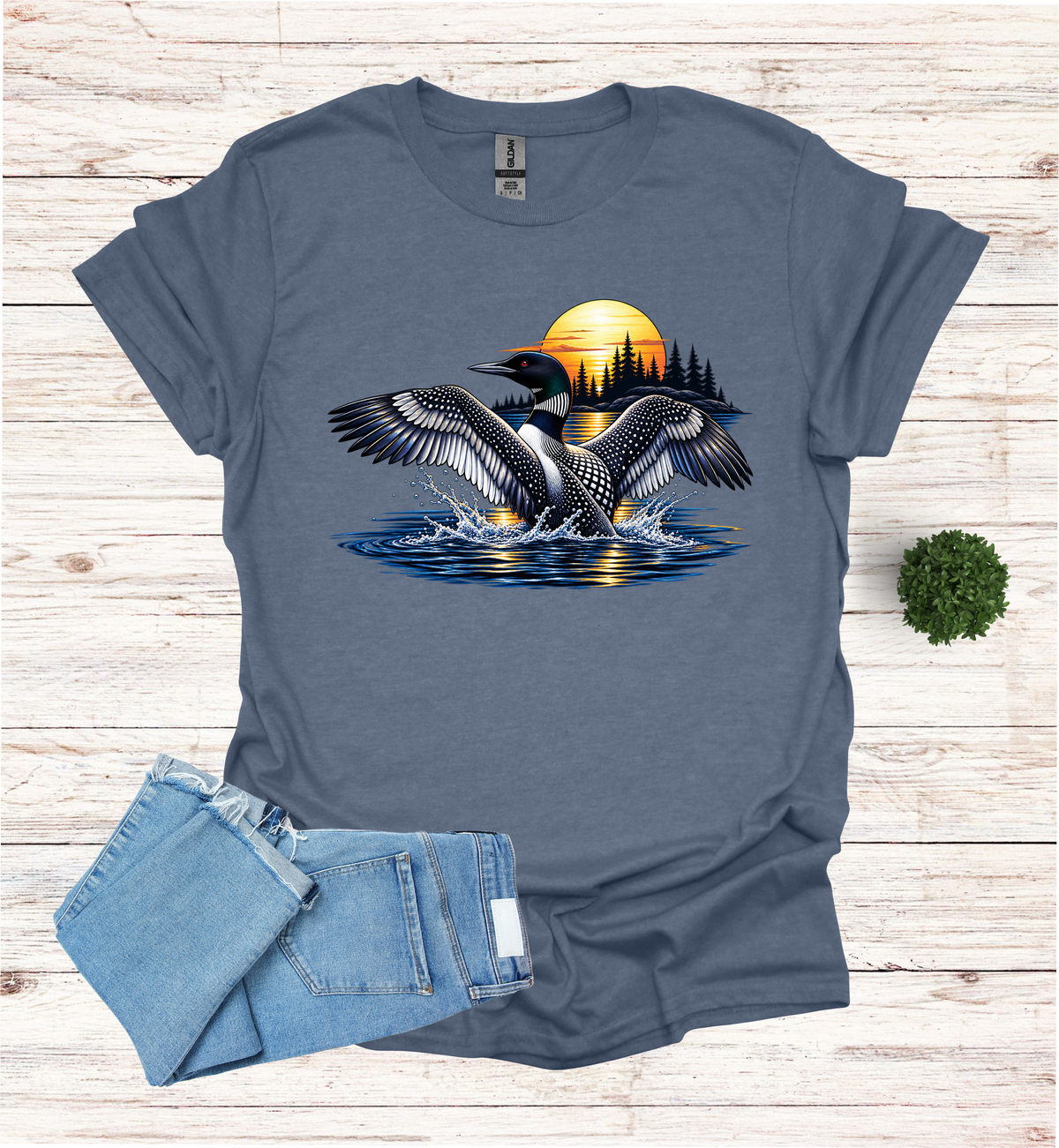 Loon flutters wings on the water