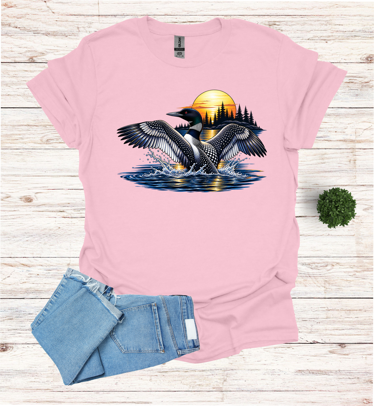 Loon flutters wings on the water