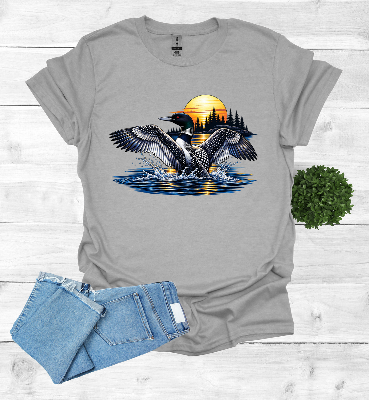 Loon flutters wings on the water