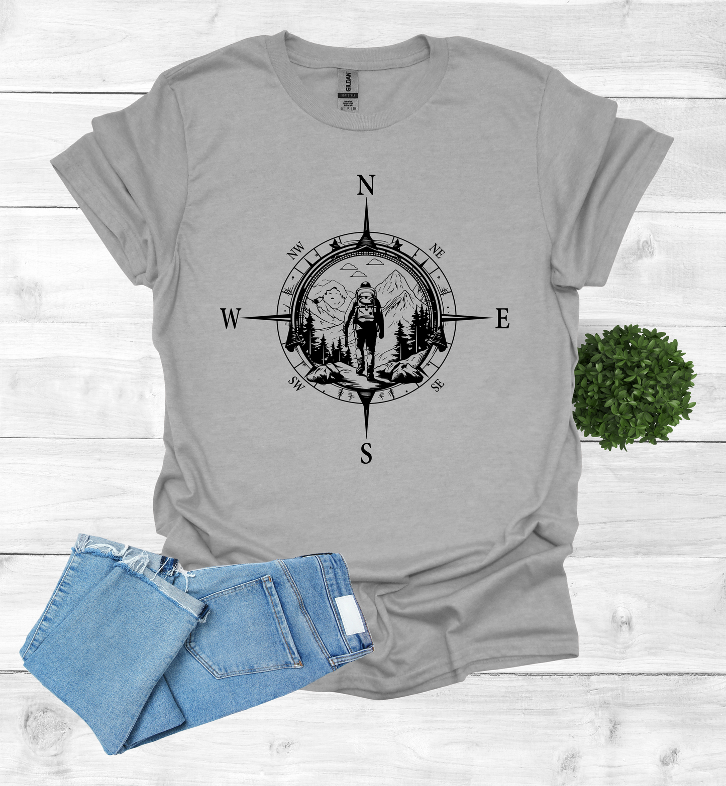 Hiker walking in wilderness compass scene